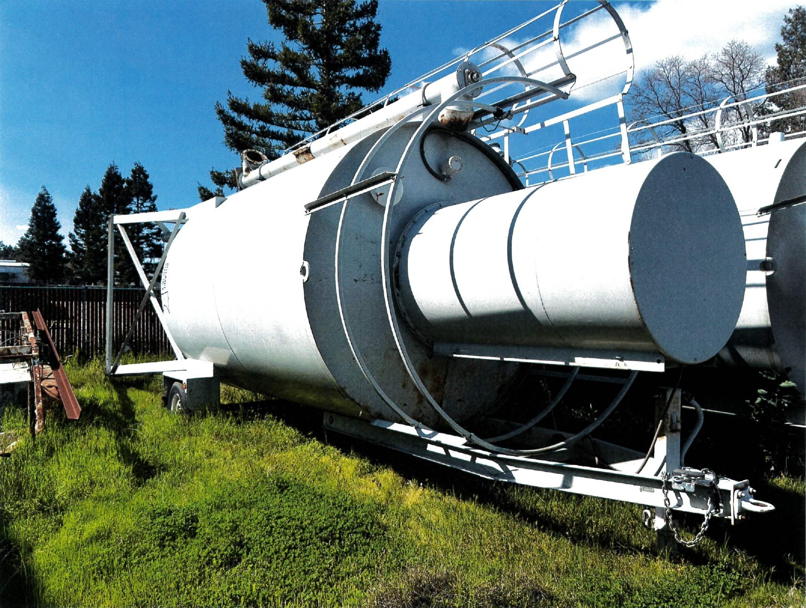 whit silo, green grass, blue sky