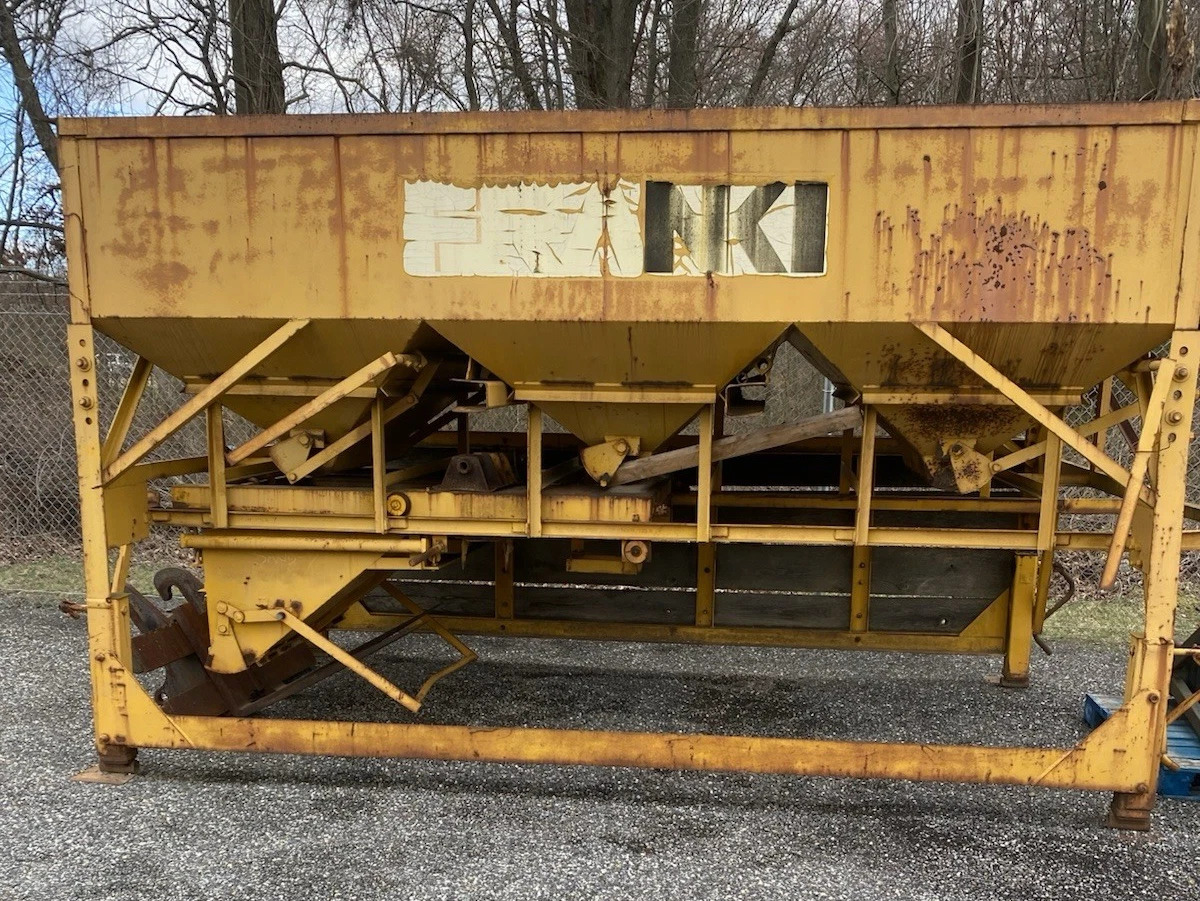 yellow, steel, three compartment aggregate scale