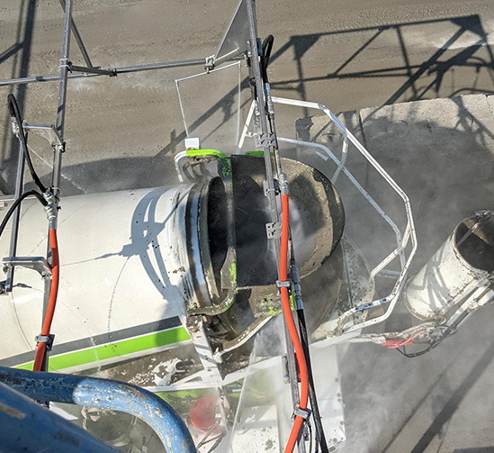 Truck wash system cleaning truck after being used on a job